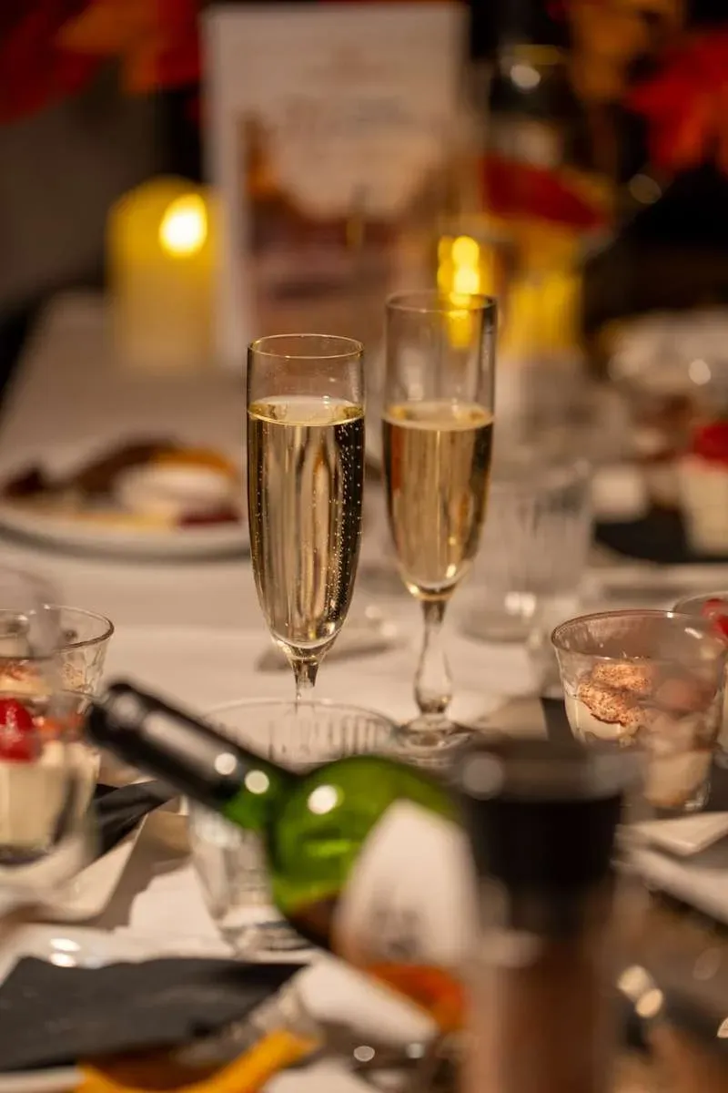 Two glasses of champagne on a candlelit dinner table on the boat
